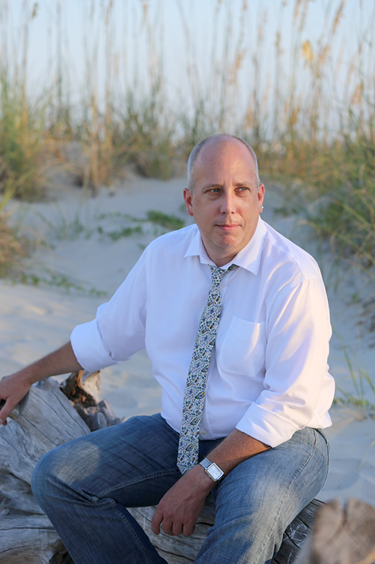 Primary officiant and assistant, Douglas Morse on Tybee Island on the beach near the dunes.