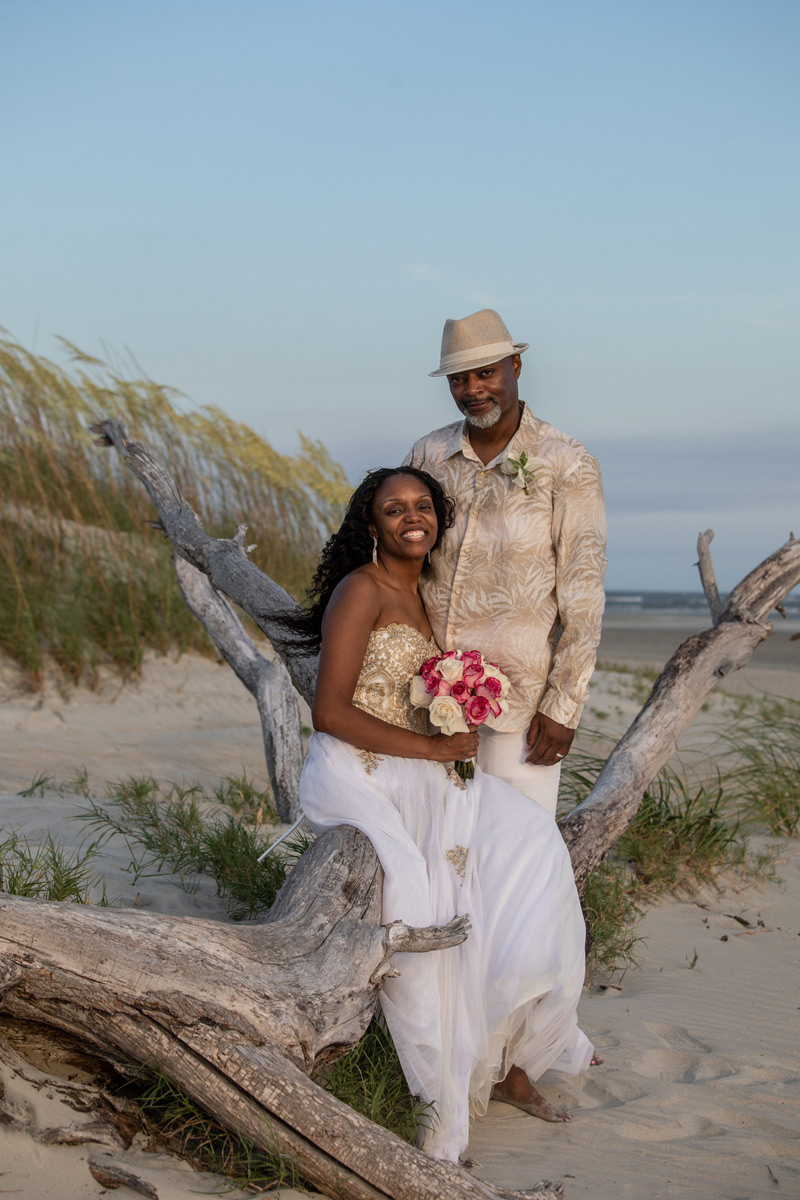 Gorgeous black couple dressed in white and gold had their romantic elopement on Tybee Island