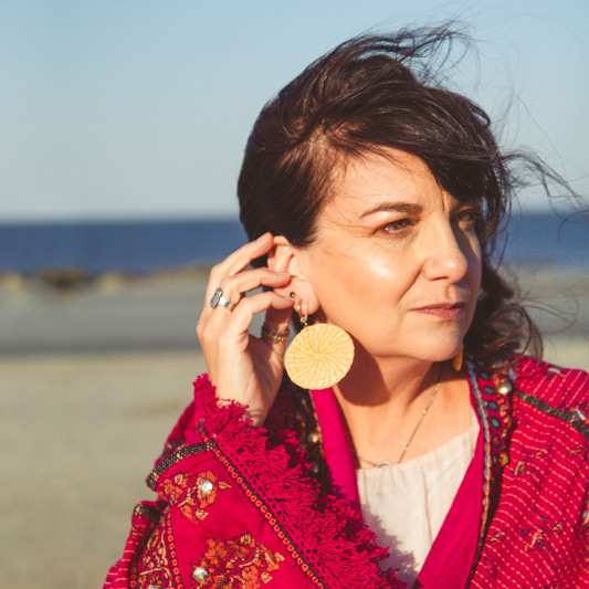 Rubi McGrory, one of our elopement officiants pictured on Tybee Island. Rubi is also an artist, writer and chef.