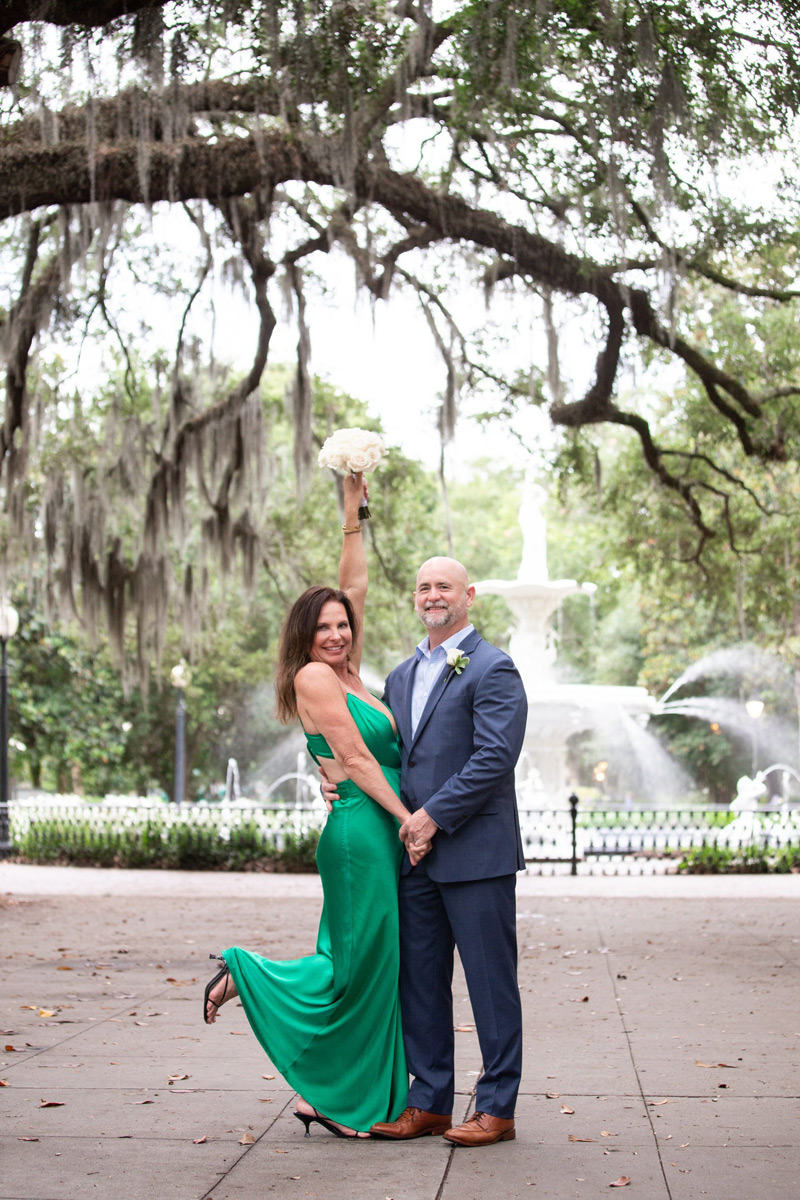 Happy couple who just eloped to Forsyth Park in front of the famous fountain